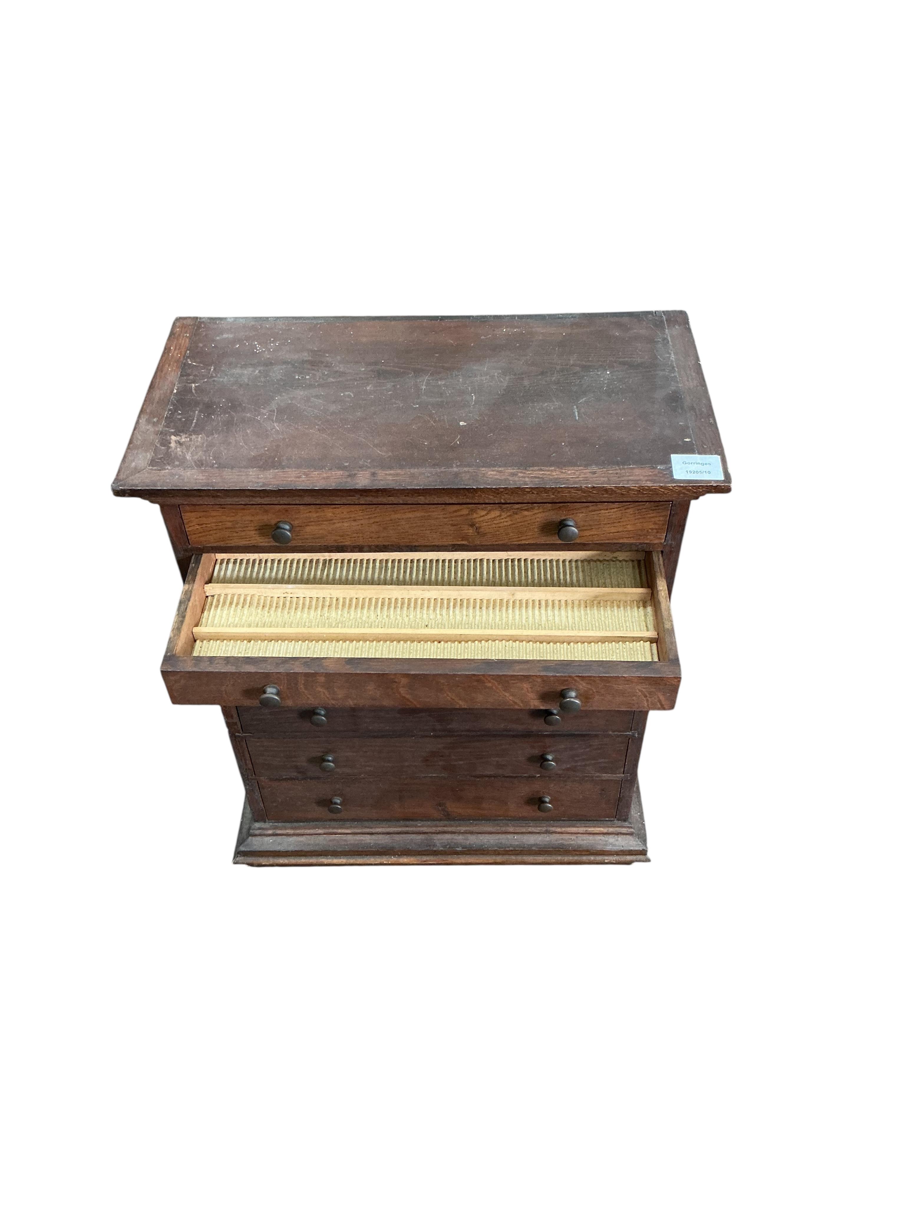 An early 20th century oak seven drawer collectors chest, width 51cm, depth 27cm, height 63cm